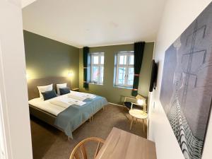 Postel nebo postele na pokoji v ubytování Hotel Ansgar