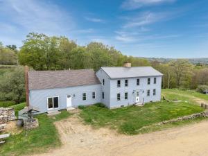 an aerial view of a white house at Cozy Highland Cattle-View Suite Peaceful, Private Pet-Friendly in Loudon +12 photos