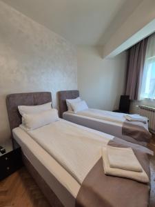 Postel nebo postele na pokoji v ubytování Hotel MB