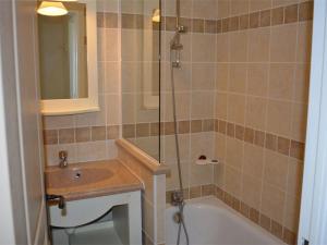a bathroom with a tub and a sink and a shower at Maison 6 pers. avec Terrasse Privée, 3 Pièces en Duplex – Wifi & Animaux Admis - FR-1-382-119 in Grospierres +5 photos
