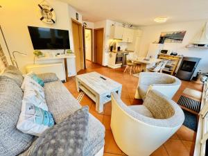 Μια τηλεόραση ή/και κέντρο ψυχαγωγίας στο Ferienhaus Lotse