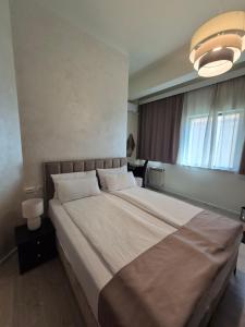 Postel nebo postele na pokoji v ubytování Hotel MB