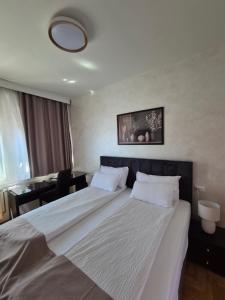 Postel nebo postele na pokoji v ubytování Hotel MB