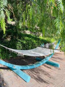 a hammock sitting on the ground in a park at Villa Afrodite in Mondragone