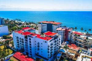 an aerial view of the ocean and buildings at Viva la vida in Bucerías