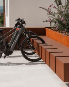 a bike is parked next to a wall at Agriturismo Prà dell'Ort - Wishing Wellness in Valdobbiadene