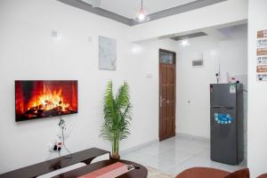 TV a/nebo společenská místnost v ubytování Upmax Cosy Home