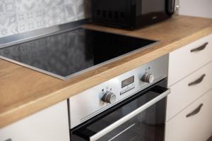 Kuchyň nebo kuchyňský kout v ubytování Apartment Div