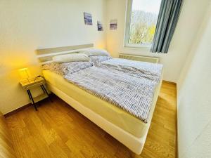Ένα ή περισσότερα κρεβάτια σε δωμάτιο στο Ferienhaus Saturn, strandnah