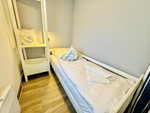 Ένα ή περισσότερα κρεβάτια σε δωμάτιο στο Ferienhaus Kliff-Haeuschen