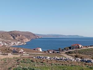 a view of a body of water from a hill at dilemi 3 in Tavari