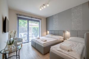 Postel nebo postele na pokoji v ubytování Trend Deluxe Siófok