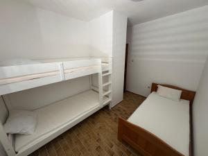 Postel nebo postele na pokoji v ubytování Apartments Prosika