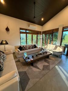 a living room with two couches and a coffee table at Turtle Pond Wilpattu in Wilpattu