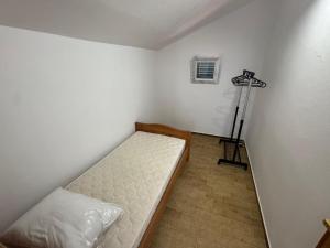 Postel nebo postele na pokoji v ubytování Apartments Prosika