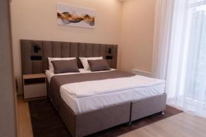 Postel nebo postele na pokoji v ubytování Hotel Palace Ukraine