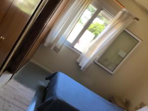 A bed or beds in a room at Platanos Rooms