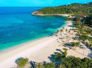 an aerial view of a beach with palm trees and the ocean at Sharon's Island - Newcoast Boracay in Boracay +3 photos