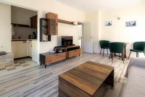 a living room with a couch and a table at Mila 6 in Burgas