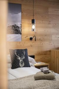 Postel nebo postele na pokoji v ubytování Hotel Dahu