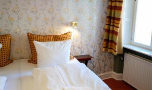 Letto o letti in una camera di Hotel Dagmar