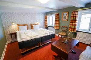 Postel nebo postele na pokoji v ubytování Hotel Dagmar