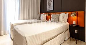 Iconyc Charlie Ibirapuera Hotel客房内的一张或多张床位