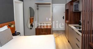 Iconyc Charlie Ibirapuera Hotel客房内的一张或多张床位