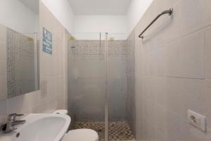 a bathroom with a shower and a toilet and a sink at Apartamentos Playa Azul - 3 in Vallehermoso +20 photos