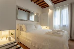 Postel nebo postele na pokoji v ubytování Tuscan Break