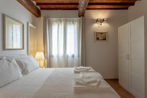 Postel nebo postele na pokoji v ubytování Tuscan Break