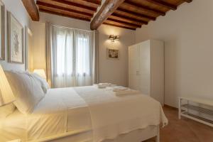 Postel nebo postele na pokoji v ubytování Tuscan Break