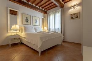 Postel nebo postele na pokoji v ubytování Tuscan Break
