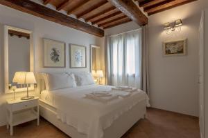 Postel nebo postele na pokoji v ubytování Tuscan Break