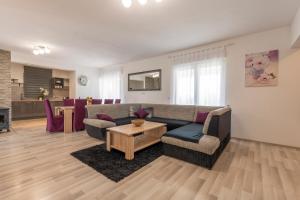 a living room with a couch and a table at Holiday home Galižana in Galižana