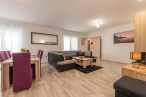a living room with a couch and a table at Holiday home Galižana in Galižana