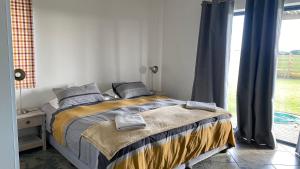 Una cama o camas en una habitación de The Foulds - Comfortable Cottage