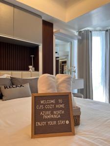 Ένα ή περισσότερα κρεβάτια σε δωμάτιο στο CJ's Cozy Home