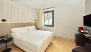 Ein Bett oder Betten in einem Zimmer der Unterkunft NH Collection Andorra Palomé