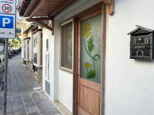 a door to a building with a sign on it at Annarè House in Ischia
