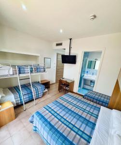 Postel nebo postele na pokoji v ubytování Hotel Ondina
