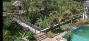 an aerial view of a house with a swimming pool at Indri Lodge in Andasibe