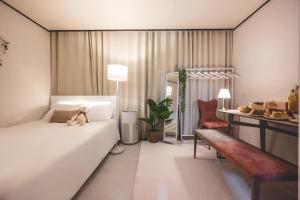 a bedroom with a bed with a teddy bear on it at 스테이 Stay - Bright Cozy House Seoul Local Stay in Seoul
