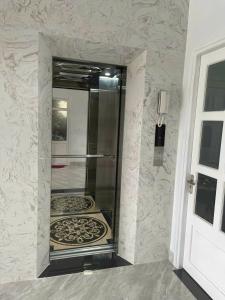 a glass shower in the corner of a room at Bích Phương HOTEL in Da Lat +22 photos