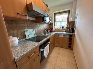 Kuchyň nebo kuchyňský kout v ubytování Ferienwohnung Cäcilia