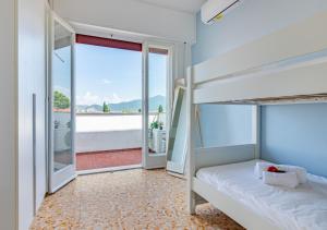 En eller flere senge i et værelse på Brg dx - Attico terrazza vista panoramica Lungarni Pisani