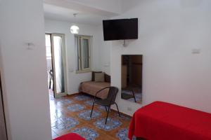 TV a/nebo společenská místnost v ubytování NUOVA AURORA Rent Rooms