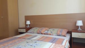 Postel nebo postele na pokoji v ubytování Apartments Tea