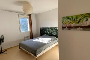 a bedroom with a bed and a window at Les Naïades I55 - 2 bedroom for 4 people in Avène