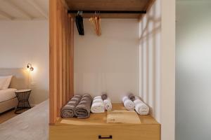 A bed or beds in a room at Dominoes Corfu